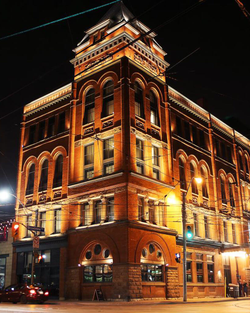 nighttime image of The Broadview Hotel from Queen Street East