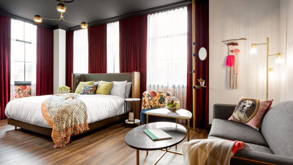 Angled photo of a guest room with the bed as the main focus at The Broadview Hotel