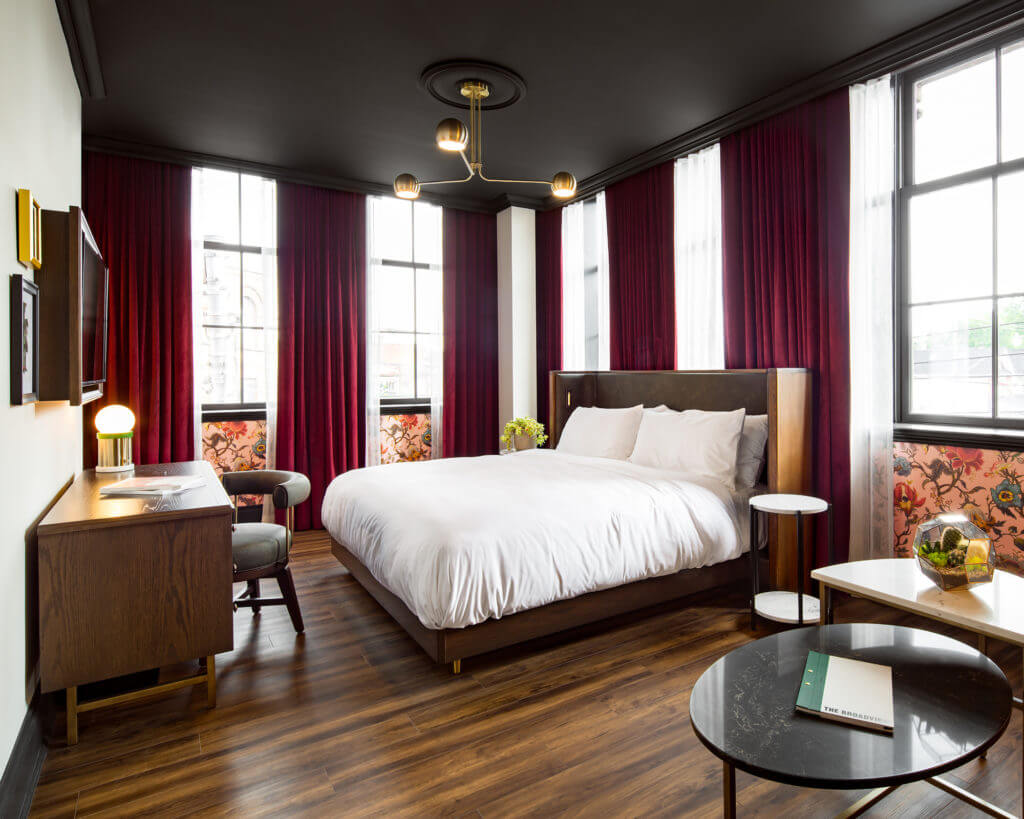 Angled photo of a guest room with the bed as the main focus at The Broadview Hotel