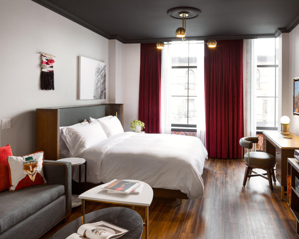 Angled photo of a guest room with the bed as the main focus at The Broadview Hotel