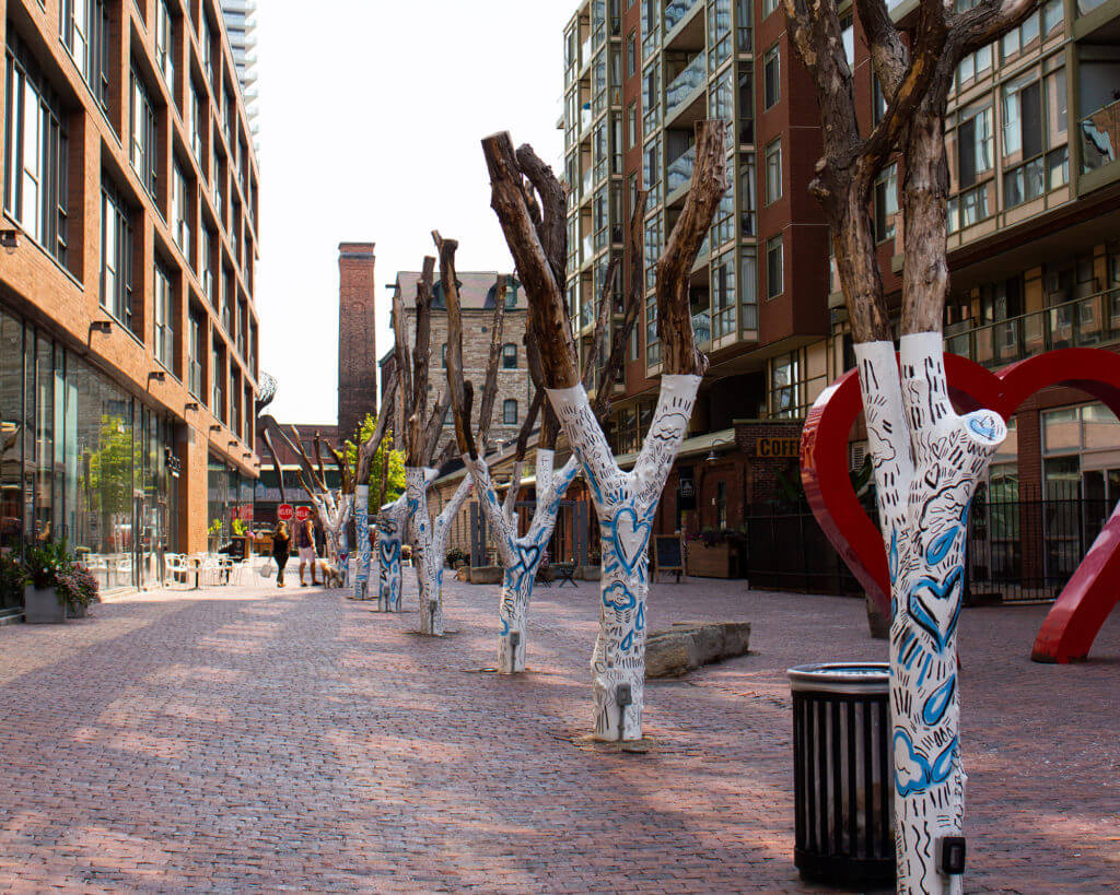 Art installation of painted trees at The Distillery District