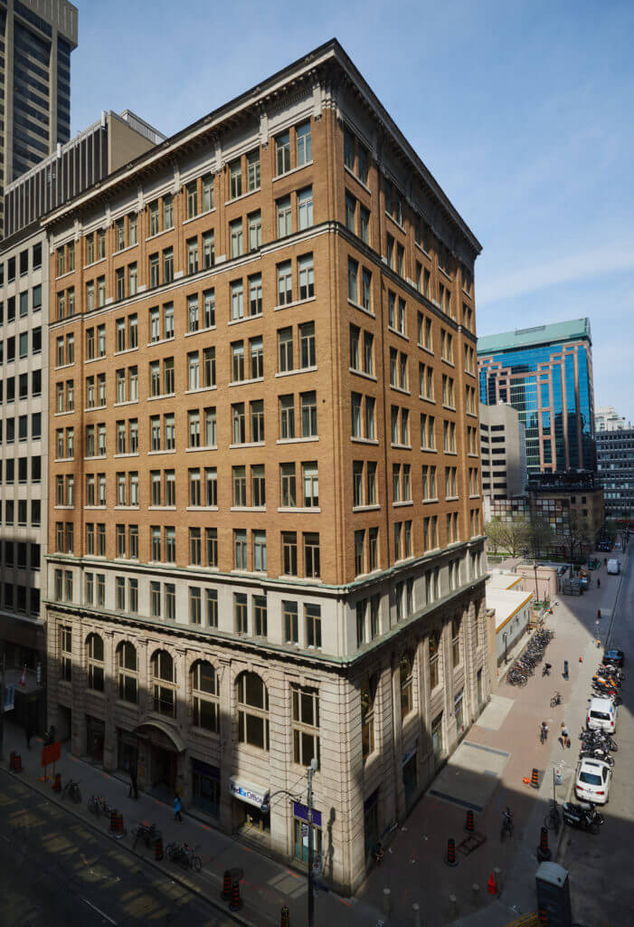 Drone image with the sun shining on Dream Office's 357 Bay Street building.