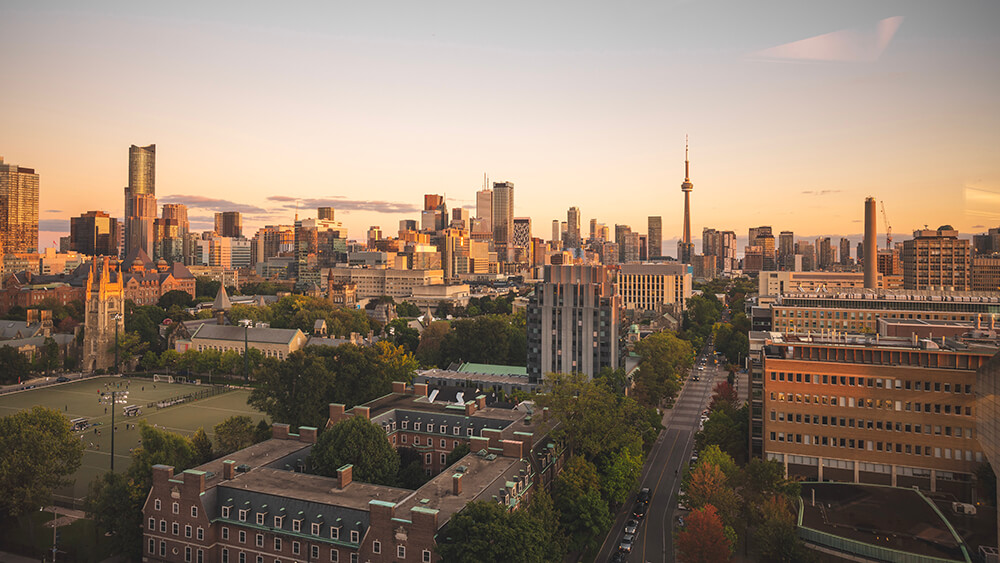 Sunset image of University of Toronto - St. George Campus with CN tower skyline