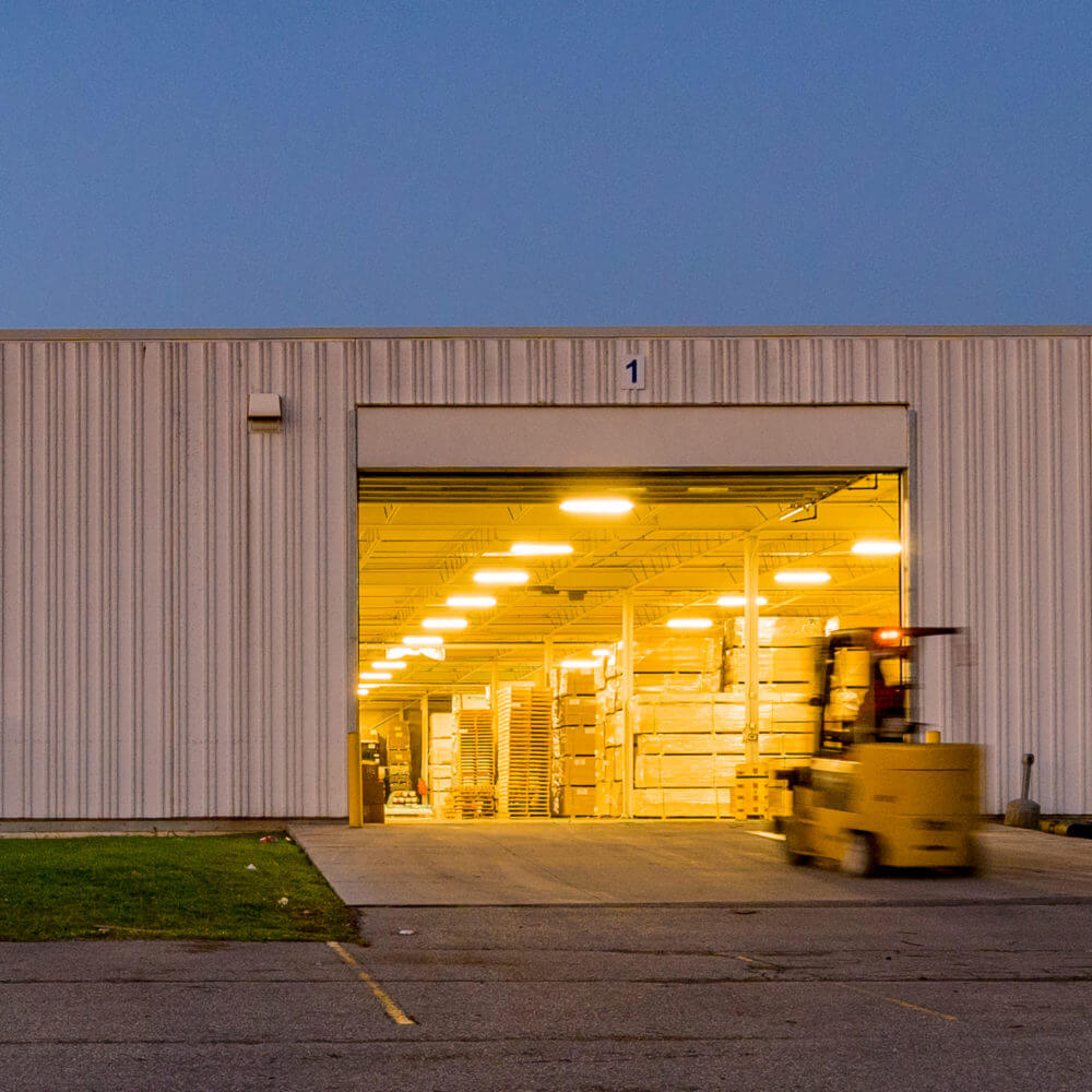 nighttime image of Dream Industrial's 300 Orenda Road entrance in Brampton, ON