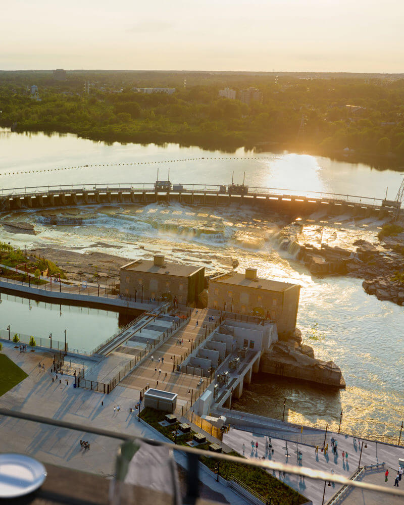 Sunset Rendering of Balcony view overlooking Chaudière Falls at Zibi