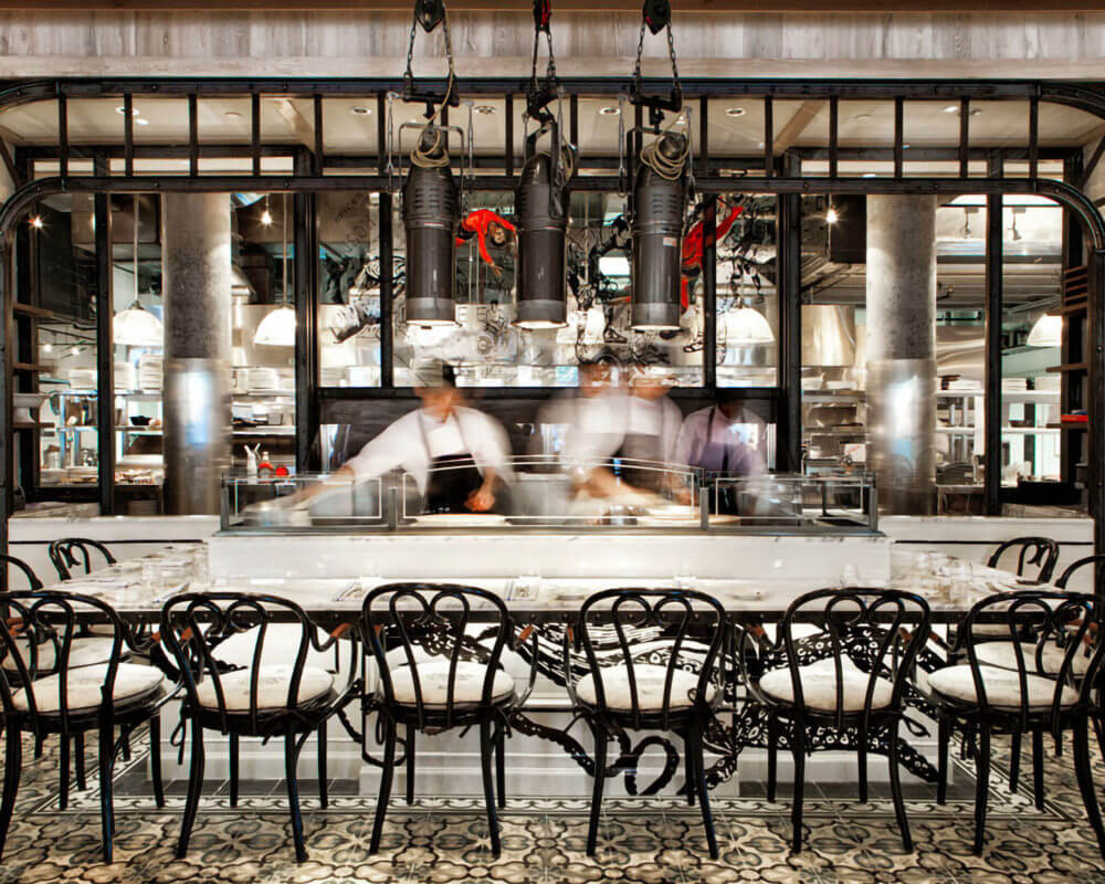 Interior of Cluny Bistro & Boulangerie with two chefs working