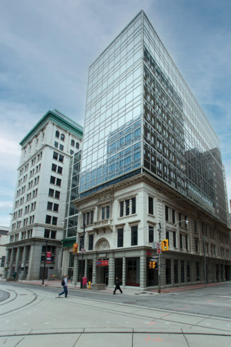 Perspective view of 36 Toronto Street a historical building with a glass tower above in Toronto