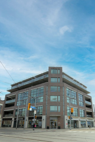 Front view of 549 King Street East, a corner building