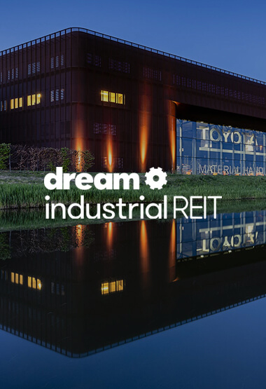 Evening shot of Ede, Netherlands Dream Industrial building with Dream Industrial REIT logo overlay in white.