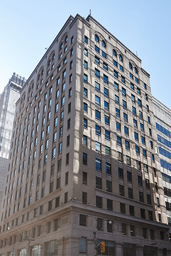 Perspective shot of Dream Office's 330 bay street on a sunny blue sky day.