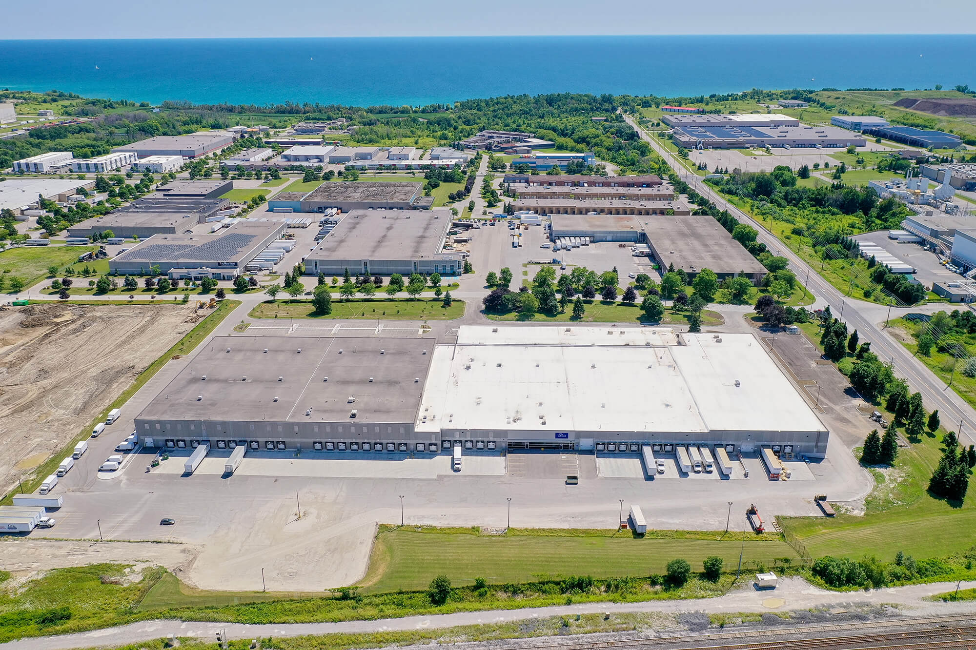 Aerial image of Dream Industrial Warehouse Building in Whitby Ontario with views of the water