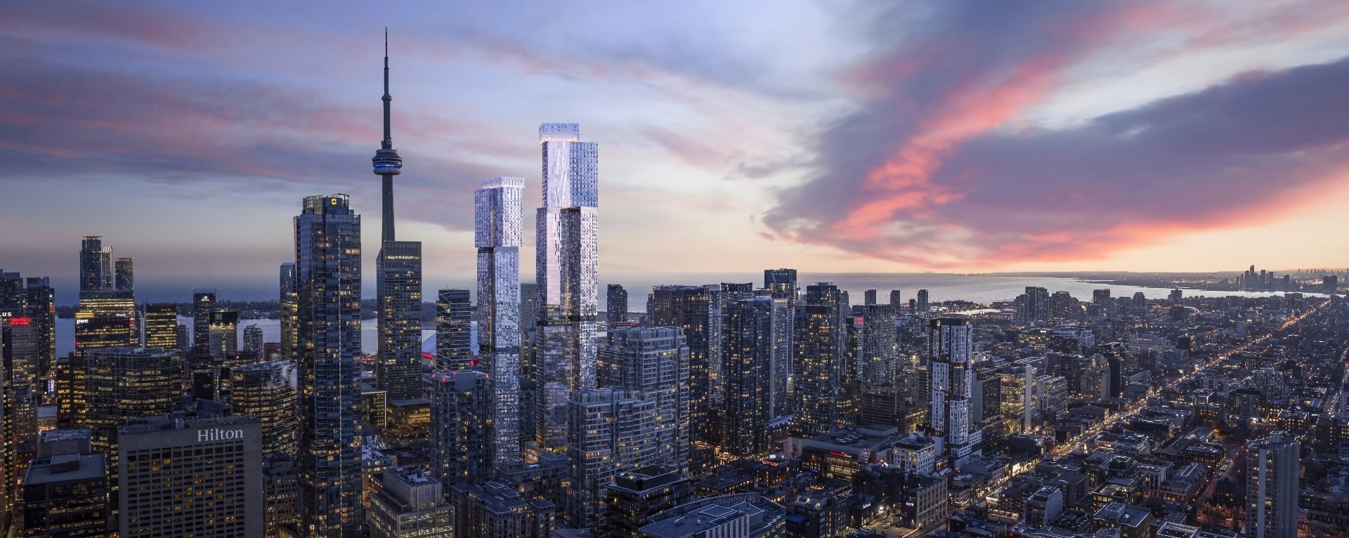 a rendering of the city of the Toronto sky line, tones of blue and pink tones blankets a busy city during the evening. Tall skyscrapers that light up the street hug the foreground of Lake Ontario.