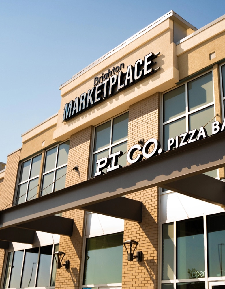 a brick facing build at Bright Market Place, showcasing the retailer PI Co Pizza Bar.